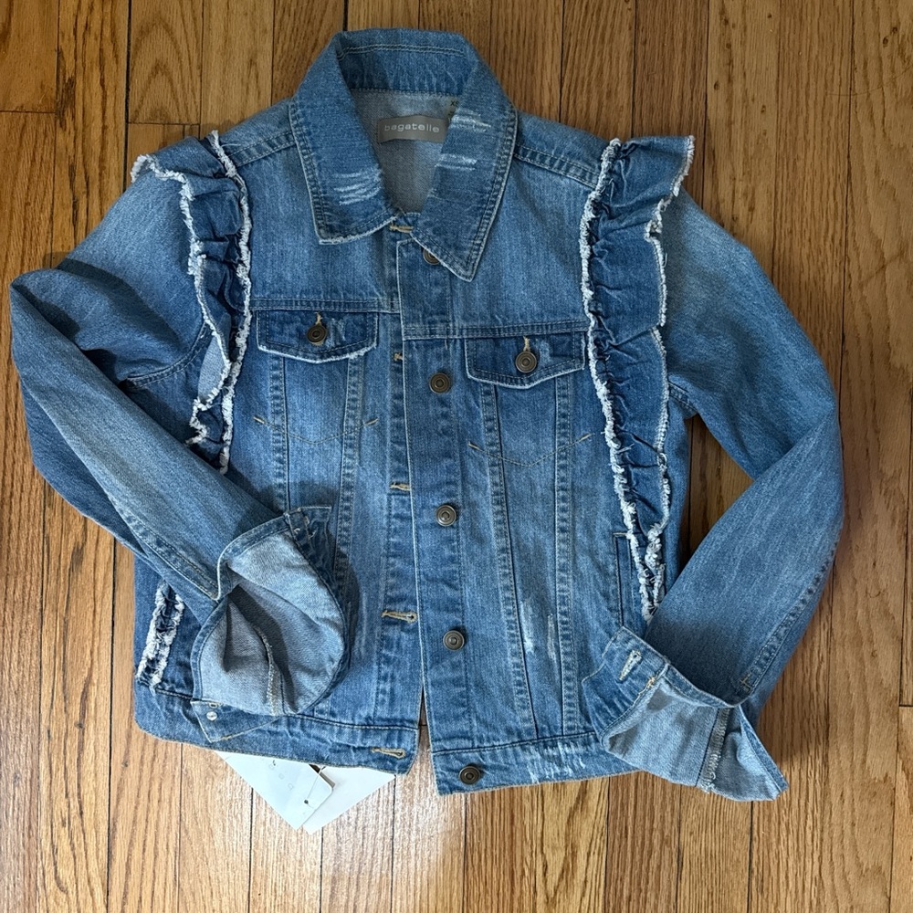 Denim jacket with distressed and ruffle details